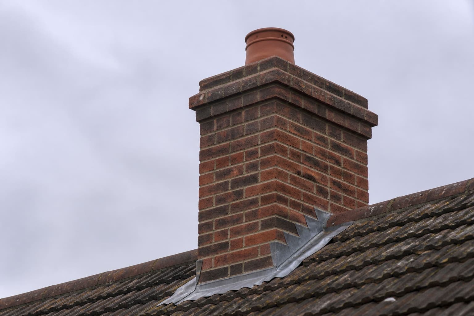 Example photograph of a brick chimney with lead flashing