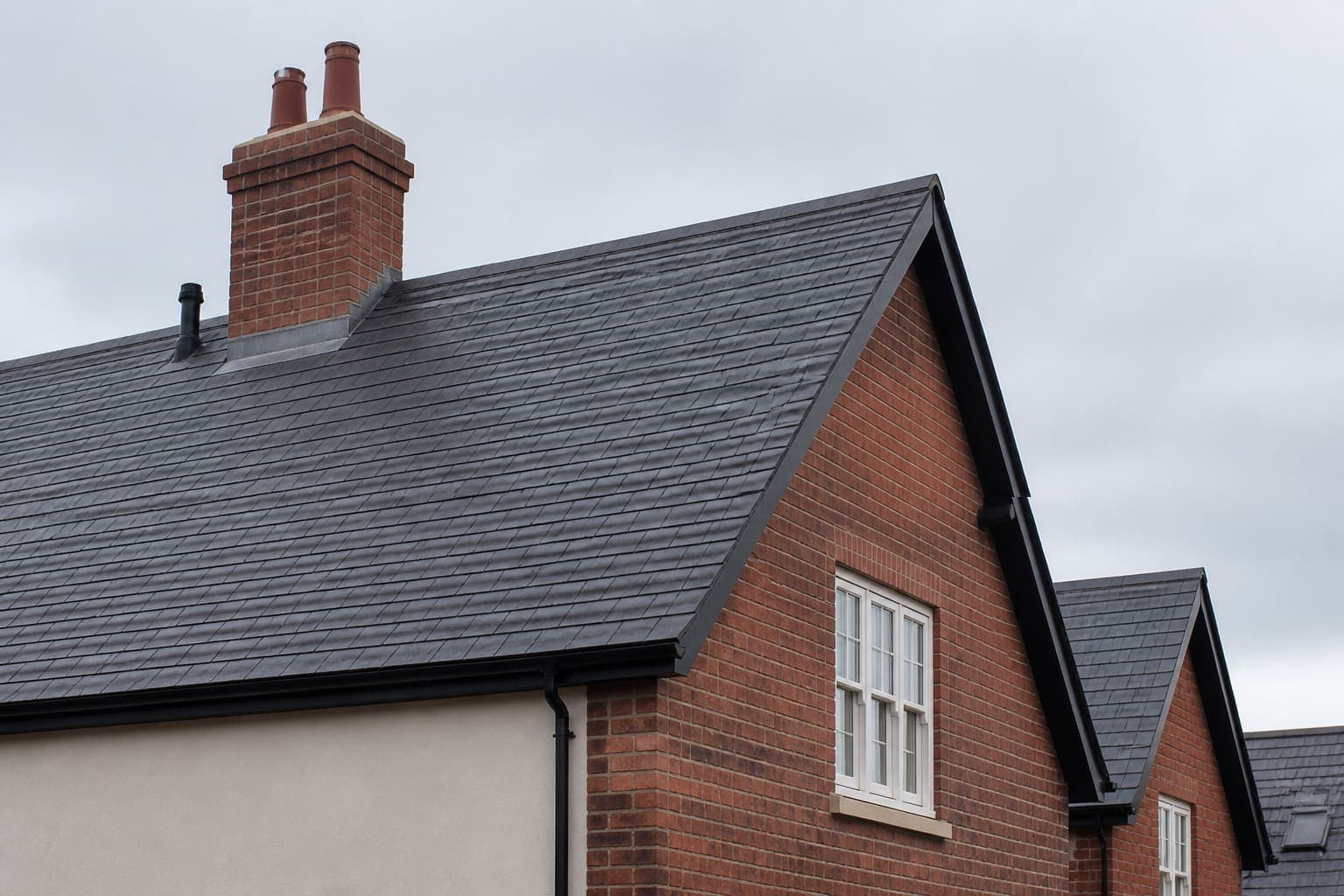 Example photograph of a dark slate pitched roof